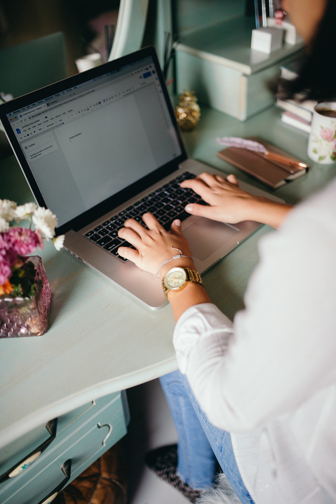 Woman using her laptop at the home.