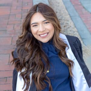 Positive ethnic woman standing on pavement